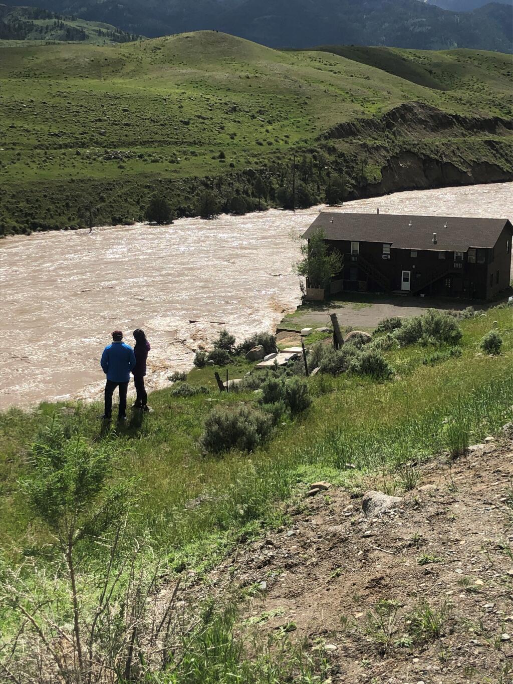 National Park Service house begins sinking into Yellowstone River on June 13. (Photo courtesy of Tate Birnie)