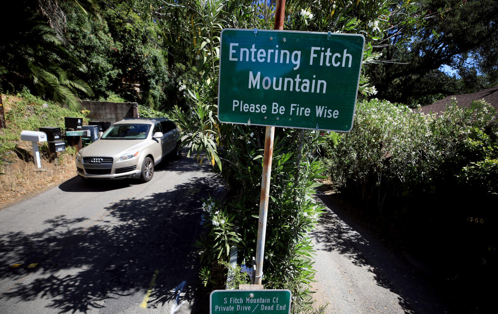On both sides of Fitch Mountain, warning signs alert residents and visitors alike to the fire danger, Thursday, May 27, 2021 in Healdsburg. An evacuation drill will take place on the Healdsburg-area mountain Saturday, June 5, 2021.  (Kent Porter / The Press Democrat)