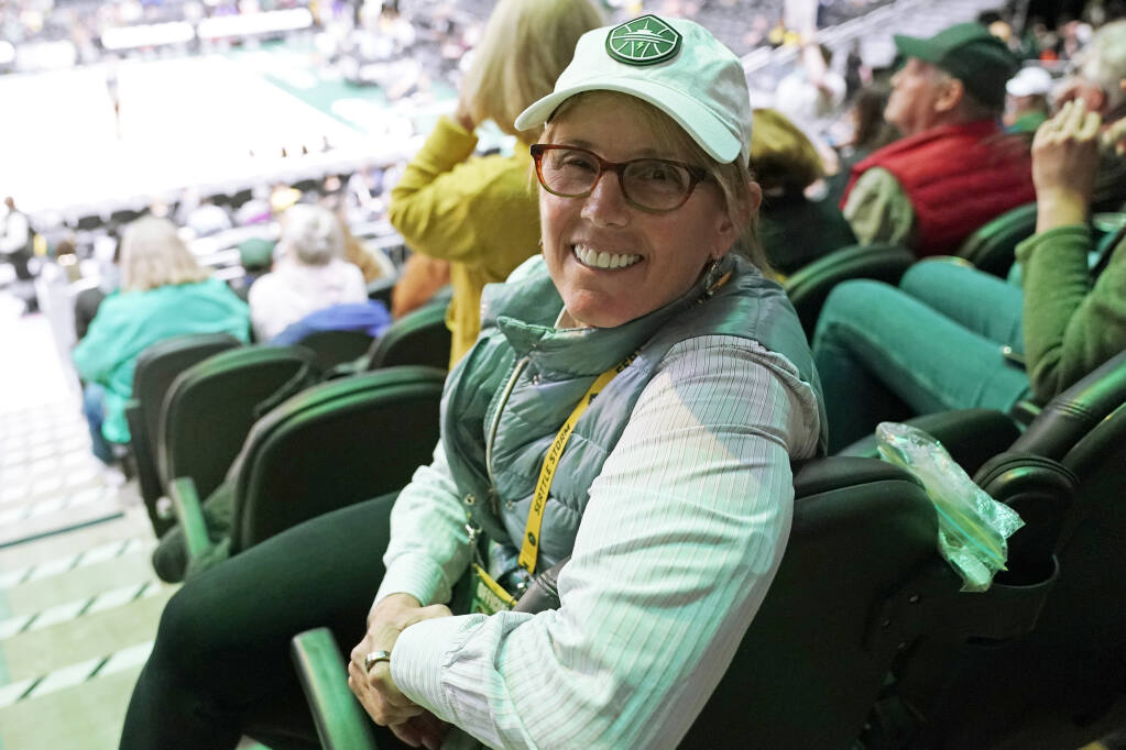 Seattle Storm co-owner Ginny Gilder poses for a photo on May 18, 2022, at Climate Pledge Arena during halftime of a WNBA basketball game between the Seattle storm and the Chicago Sky in Seattle. As Title IX marks its 50th anniversary in 2022, Gilder is one of countless women who benefited from the enactment and execution of the law and translated those opportunities into becoming leaders in their professional careers. (AP Photo/Ted S. Warren)