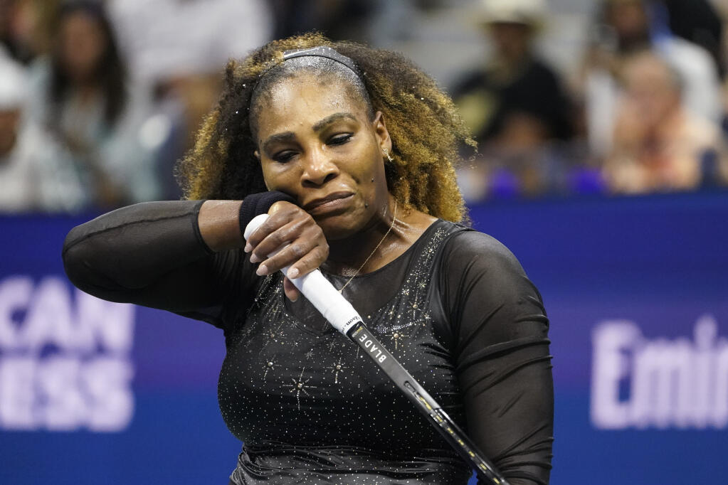 Serena Williams, of the United States, wipes her face during her match with Danka Kovinic, of Montenegro, at the first round of the US Open tennis championships, Monday, Aug. 29, 2022, in New York. (AP Photo/John Minchillo)