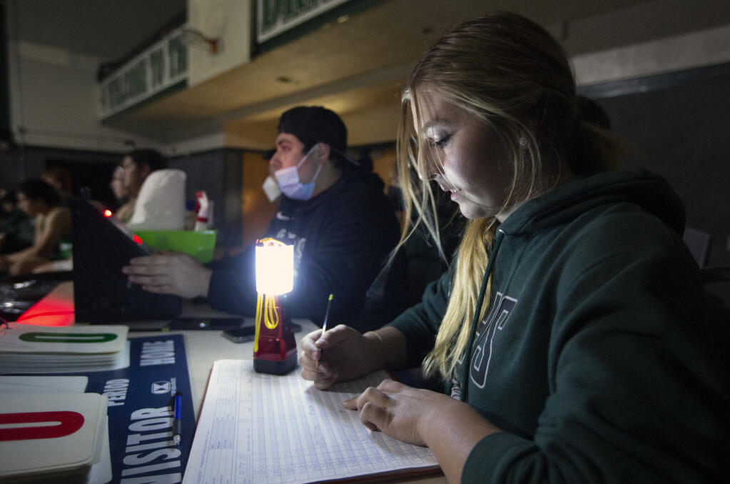 As team statistician, Miki Borgnis keeps track of the wrestling match between the Sonoma Dragons and Casa Grande in Golton Hall on Wednesday, Jan.5, 2021. (Robbi Pengelly/Index-Tribune)