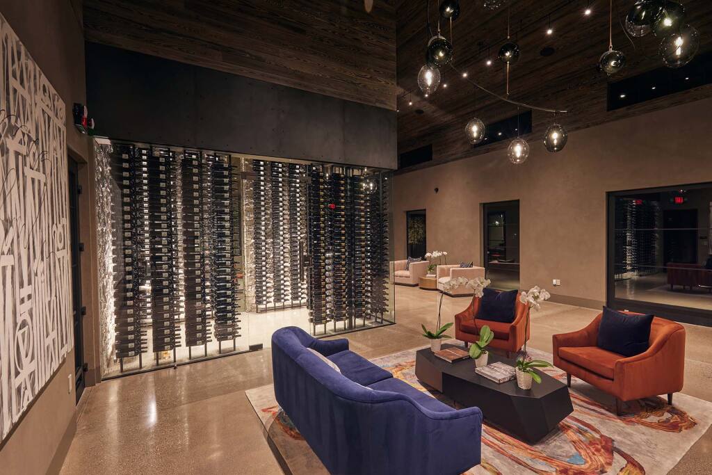 A new hospitality building at Seven Apart Winery, located at the base of Atlas Peak in Napa Valley,  has four outdoor private tasting venues and three unique fountains, along with a floor-to-ceiling window where guests can view a custom wine display and a large wine rack system as well as a one of a kind wall-to-wall operable window.