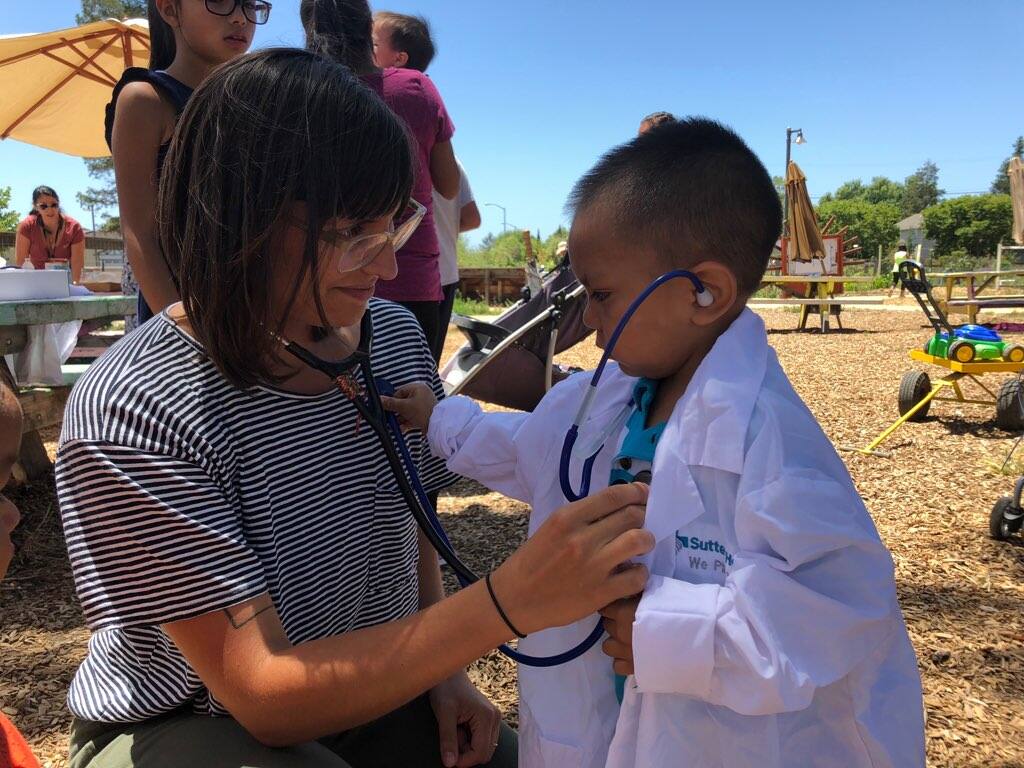 Lara Crystal-Ornelas, a resident in the Sutter program, connects with very young potential future doctor.  (Courtesy Photo)