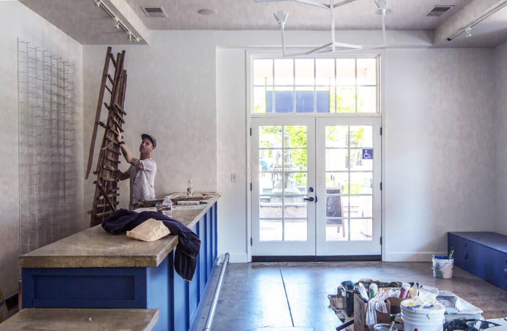 Jeremy Heinemann, proprietor of Sonoma Valley Painting, works on painting the interior of what will be the newest wine tasting room, Darling Coastal Wines, in the Sonoma Court Shops on East Napa Street on Monday, April 18, 2022. (Robbi Pengelly/Index-Tribune)