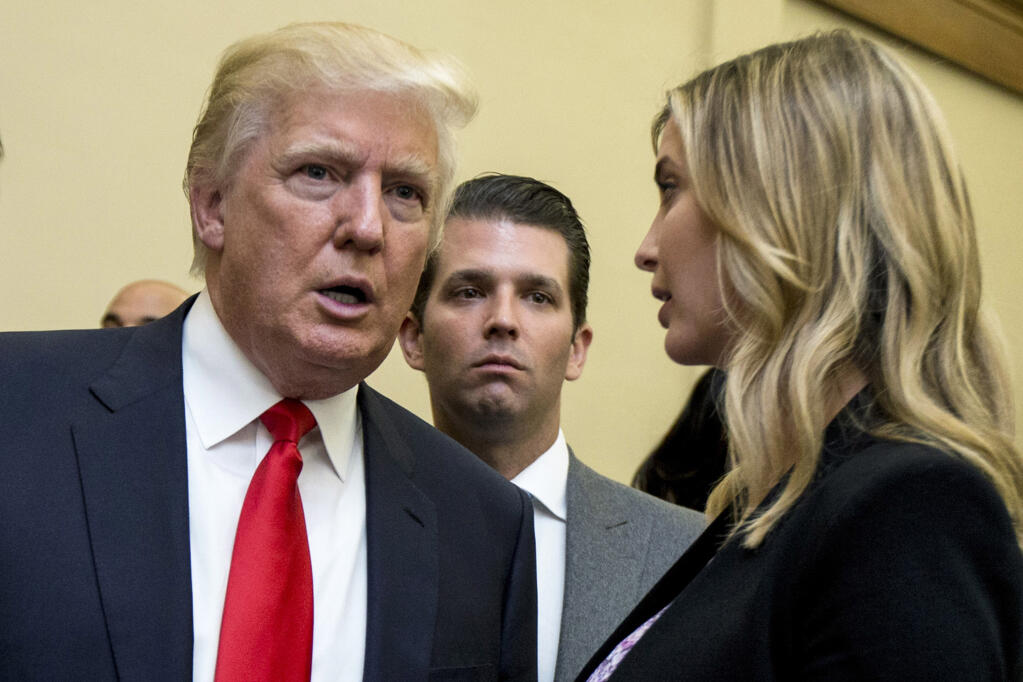 FILE - Donald Trump, left, his son Donald Trump Jr., center, and his daughter Ivanka Trump speak during the unveiling of the design for the Trump International Hotel, in Washington, Sept. 10, 2013. Former President Trump and two of his children got their questioning postponed Friday, July 15, 2022, in a New York civil investigation into their business dealings, a delay that follows the death of Trump’s ex-wife Ivana.  (AP Photo/Manuel Balce Ceneta, File)