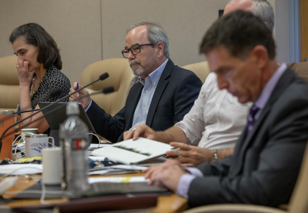 A speaker addresses the Sonoma County Board of Supervisors in Santa Rosa as Supervisor Chris Coursey listens, Tuesday, Aug. 15, 2023, during public comment about a serious animal abuse case that resulted in the death of a horse. (Chad Surmick / The Press Democrat)