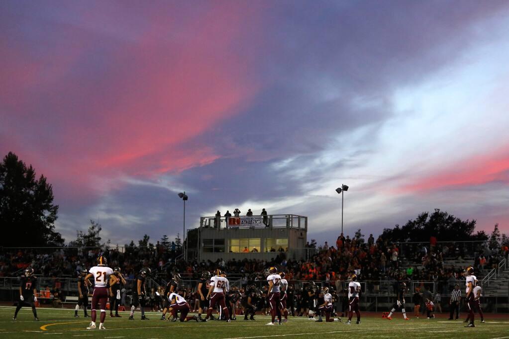 Colorful clouds linger above a varsity football game between Piner and Santa Rosa high schools in Santa Rosa, California on Friday, Sept. 2, 2016. (ALVIN JORNADA/THE PRESS DEMOCRTAT)