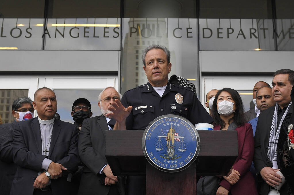 FILE - In this June 5, 2020, file photo, Los Angeles police chief Michel Moore speaks during a vigil with members of professional associations and the interfaith community at Los Angeles Police Department headquarters in Los Angeles. The LAPD officer who shared a photo of George Floyd with the words "you take my breath away," was found not guilty of any administrative charges by an internal disciplinary panel comprised of community members, the Los Angele Police Department confirmed, Tuesday, July 6, 2021. Moore had directed the officer to the panel, known as the Board of Rights, in May with the recommendation that the officer be fired. The officer has not been named publicly. (AP Photo/Mark J. Terrill, File)