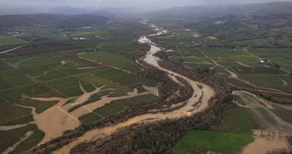 Viewing north, the Russian River flows south just below flood stage through Alexander Valley, Sunday, Jan. 8, 2023 (Kent Porter/The Press Democrat)