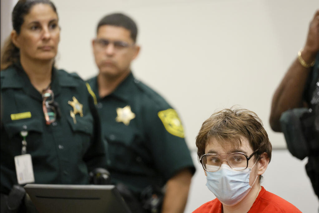 Marjory Stoneman Douglas High School shooter Nikolas Cruz sits at the defense table during a victim impact statements at his sentencing hearing at the Broward County Courthouse  in Fort Lauderdale, Fla., on Wednesday, Nov. 2, 2022.  Cruz was sentenced to life in prison for murdering 17 people at Parkland's Marjory Stoneman Douglas High School more than four years ago. (Amy Beth Bennett/South Florida Sun Sentinel via AP, Pool)