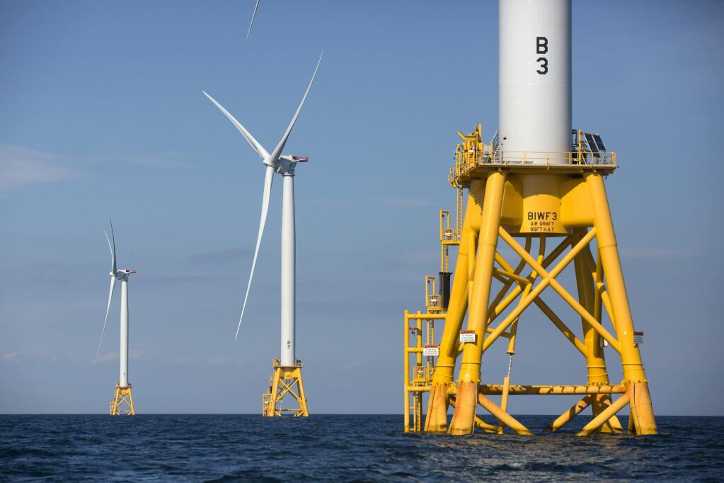 Three turbines from the Deepwater Wind project stand off Block Island, Rhode Island. President Joe Biden announced an ambitious plan to generate wind energy off of California’s coast. (MICHAEL DWYER / Associated Press, 2016)