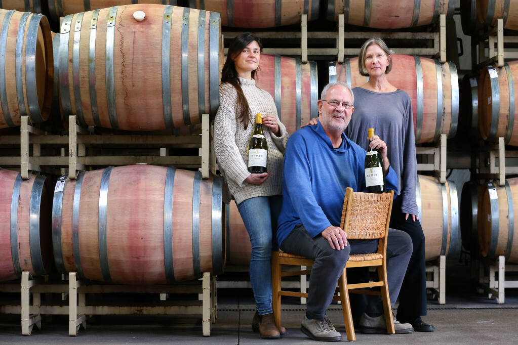 David Ramey, center, with his wife Carla, right, and their daughter Claire Ramey of Ramey Wine Cellars in Healdsburg on Wednesday, December 8, 2021.  (Christopher Chung/ The Press Democrat)