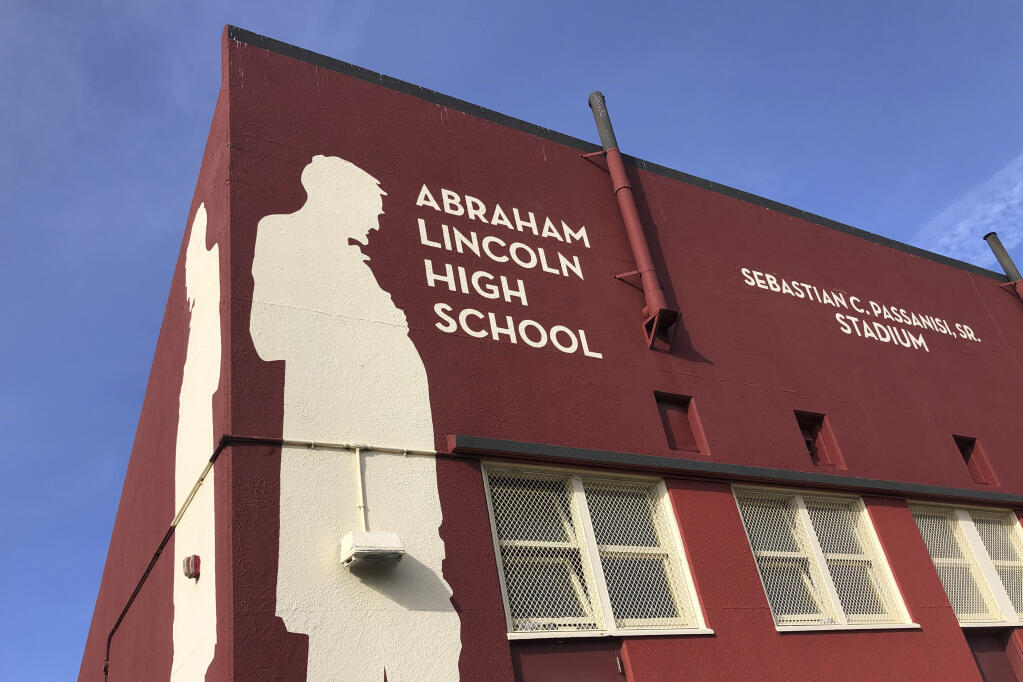 Abraham Lincoln High School is seen in San Francisco, on Jan. 27, 2021. The embattled San Francisco school board is poised to reverse a decision to rename 44 schools in an effort to avoid costly litigation and tone down national criticism. In a Tuesday, April 6, 2021, meeting, the board will vote on a resolution to rescind a controversial January decision to rename schools and revisit the matter after all students have returned full-time to in-person learning. (Haven Daley / Associated Press)