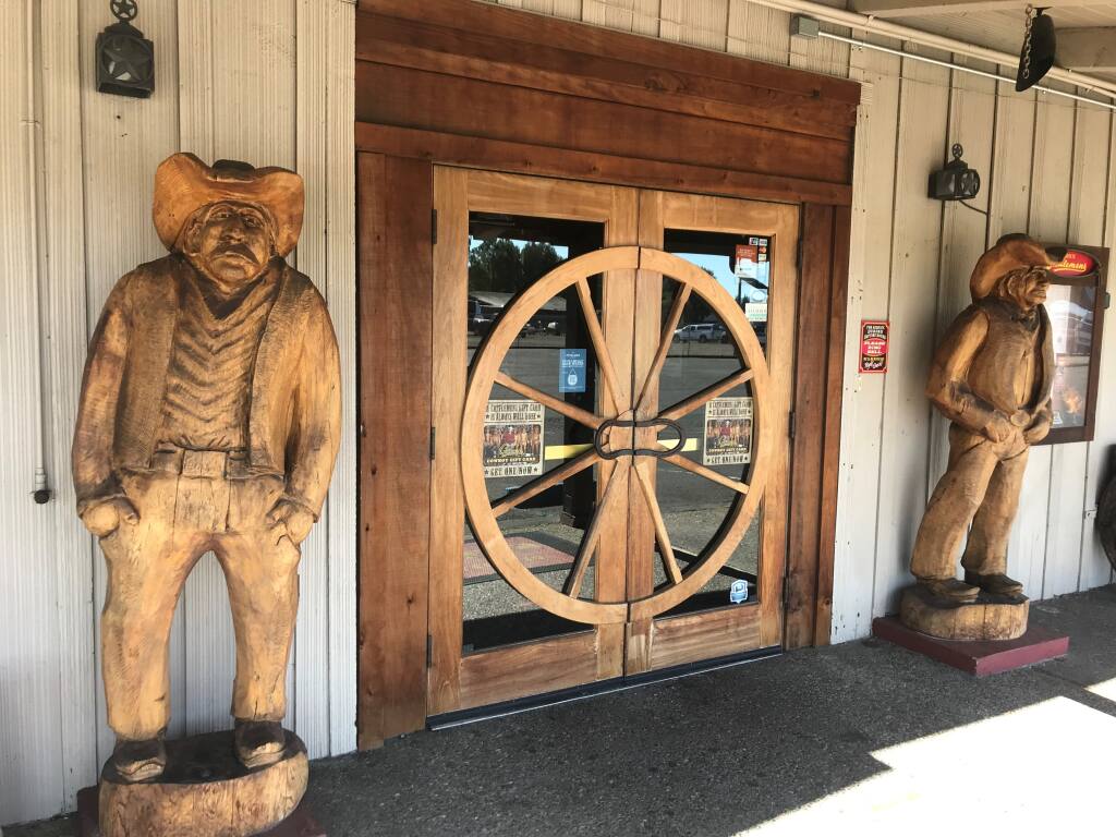 The iconic wooden cowboys of Cattlemens restaurant in Petaluma, seen here on Thursday, Oct. 27, 2022, could be removed along with the rest of the structure in order to make way for a Chick-fil-A. (Don Frances/Argus-Courier)