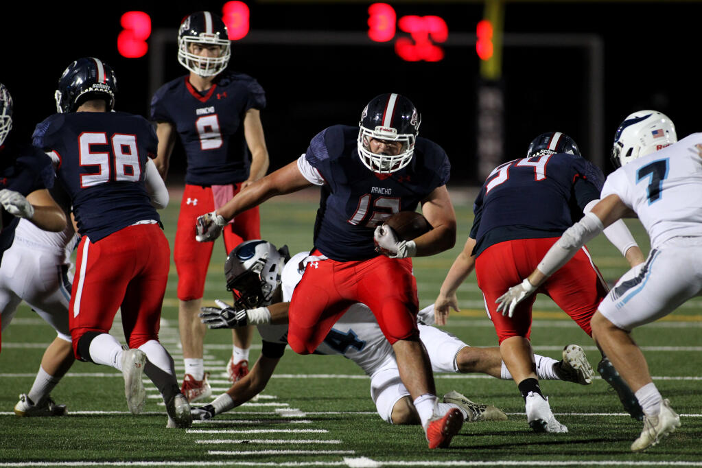Rancho Cotate's Ryan Kane (12) begins his touchdown run in the first half against Pleasant Valley (Chico, Calif.), in football at Rancho Cotate High School, in Rohnert Park, Calif., on Friday, October 1, 2021. (Photo by Darryl Bush / For The Press Democrat)