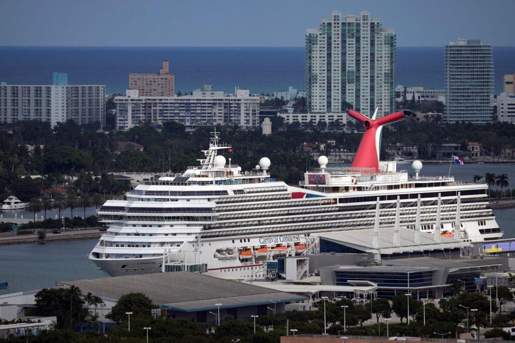 FILE - The Carnival Conquest cruise ship sits docked at port on Oct. 20, 2021, in Miami. (AP Photo/Rebecca Blackwell, File)