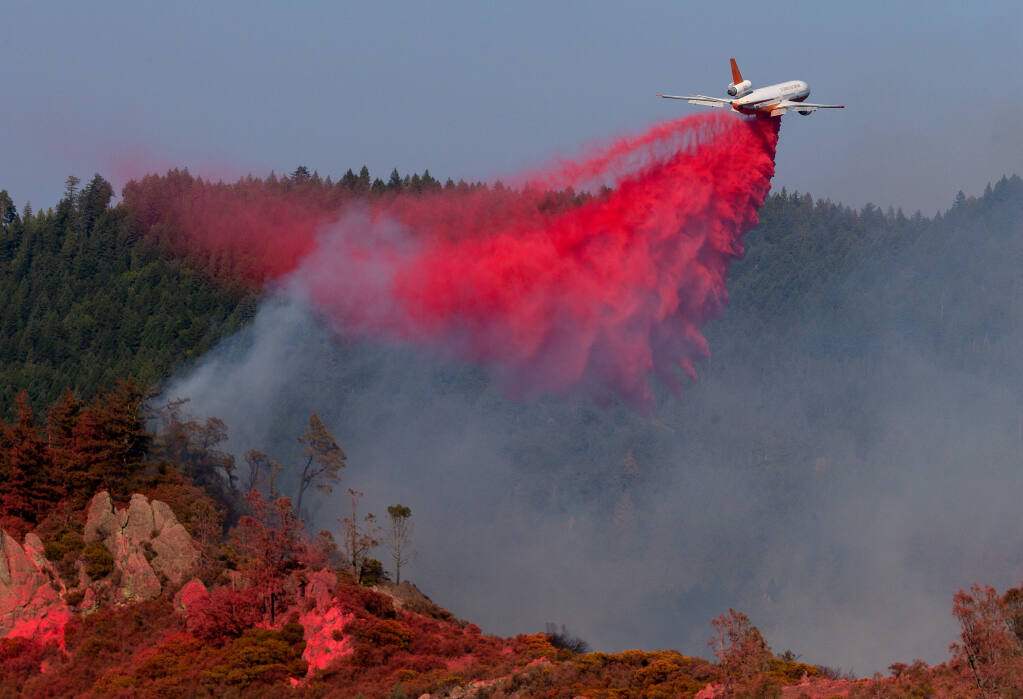 A DC-10 VLAT (Very Large Air Tanker) drops fire retardant ahead of flames from the Glass fire at Robert Louis Stevenson State Park near Calistoga on Saturday, Oct. 3, 2020. (Alvin A.H. Jornada / The Press Democrat)