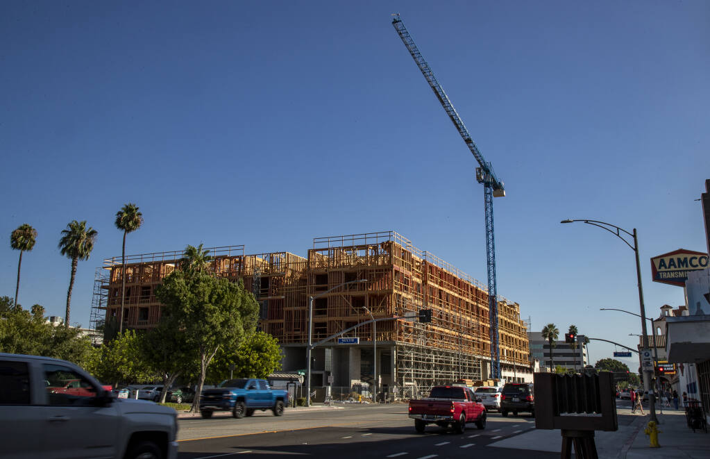 Construction for Mark Riverside, a 22,000 square foot retail space with 165 housing units in downtown Riverside. (GINA FERAZZI / Los Angeles Times, 2020)