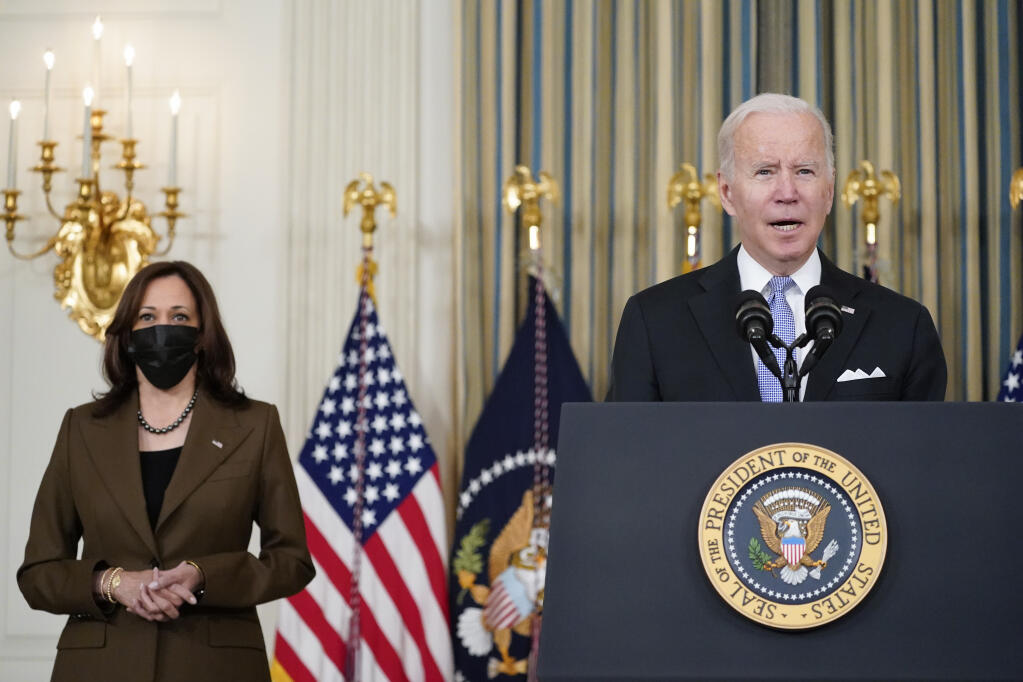Vice President Kamala Harris listens as President Joe Biden speaks a day after Congress passed the administration’s infrastructure bill. (ALEX BRANDON / Associated Press)