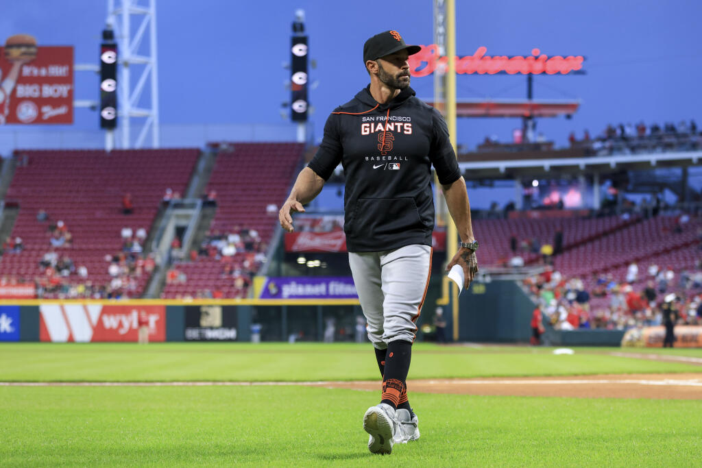 San Francisco Giants' Gabe Kapler walks to the dugout prior to a baseball game against the Cincinnati Reds in Cincinnati, Friday, May 27, 2022. The Reds won 5-1. (AP Photo/Aaron Doster)