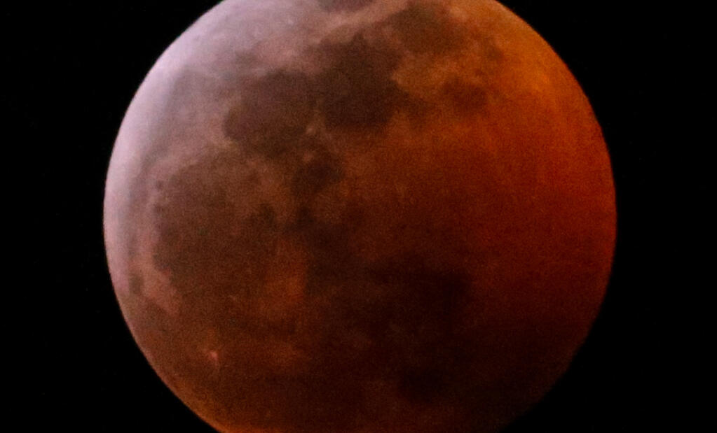 A 'Super Blood Moon' is seen in Los Angeles, Sunday Jan. 20, 2019. (AP Photo/Ringo H.W. Chiu)