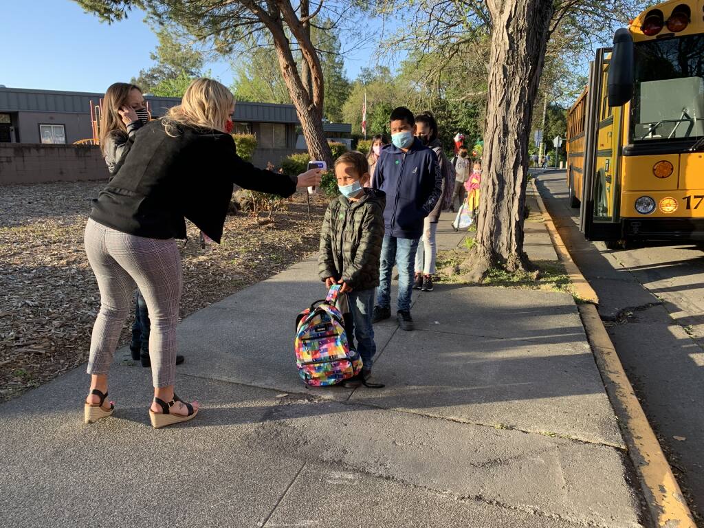 Students return to Brook Hill Elementary School in Santa Rosa on Thursday, April 1, 2021. (Christopher Chung / The Press Democrat)
