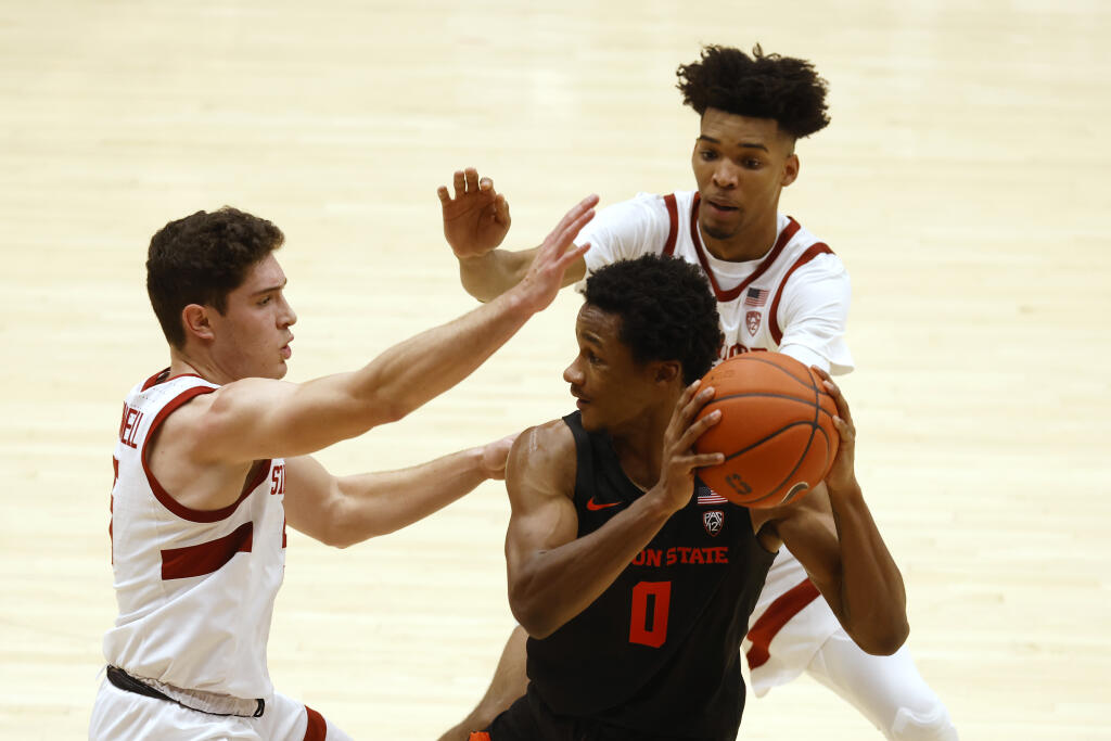 Stanford guard Michael O’Connell, left, and forward Ziaire Williams defend against Oregon State guard Gianni Hunt during the second half in Stanford on Saturday, Feb. 27, 2021. (Josie Lepe / ASSOCIATED PRESS)