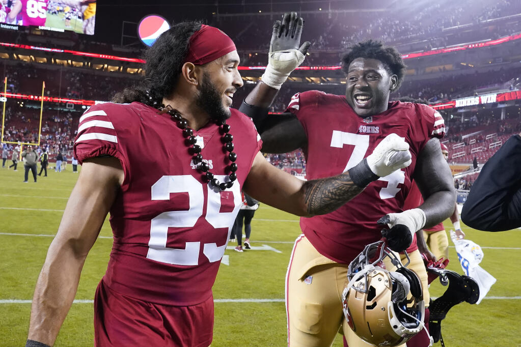 San Francisco 49ers safety Talanoa Hufanga (29) celebrates with offensive tackle Spencer Burford after the 49ers defeated the Los Angeles Chargers in an NFL football game in Santa Clara, Calif., Sunday, Nov. 13, 2022. (AP Photo/Godofredo A. Vásquez)