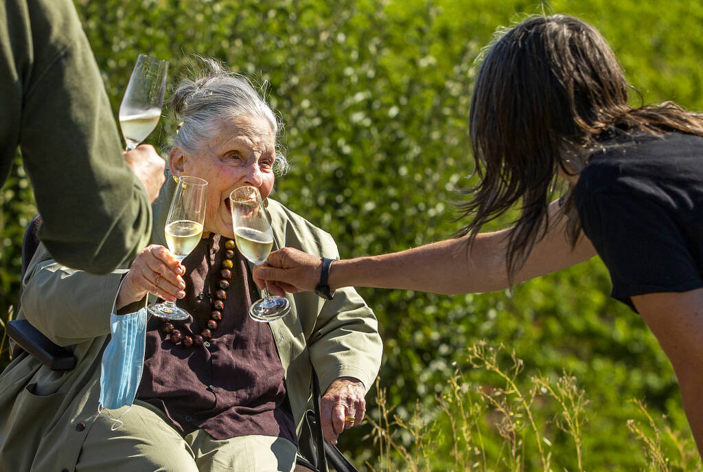Iron Horse Vineyards matriarch Audrey Sterling toasts her 45th blessing of the grapes on the first day of harvest in Sebastopol on Wednesday, August 11, 2021. (Photo by John Burgess/The Press Democrat)