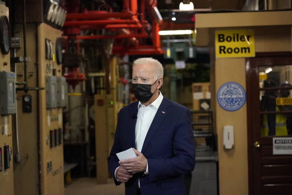 President Joe Biden listens as he tours the Sewerage & Water Board's Carrollton water plant, Thursday, May 6, 2021, in New Orleans. (AP Photo/Alex Brandon)
