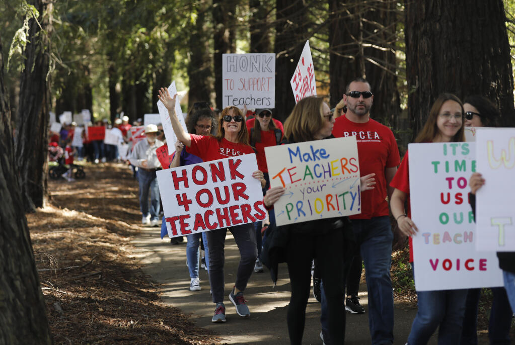 Supporters and teachers in the Cotati-Rohnert Park Unified School District picket along Rohnert Park Expressway during their strike for higher wages in Rohnert Park, Calif., on Monday, March 14, 2022.(Beth Schlanker/The Press Democrat)