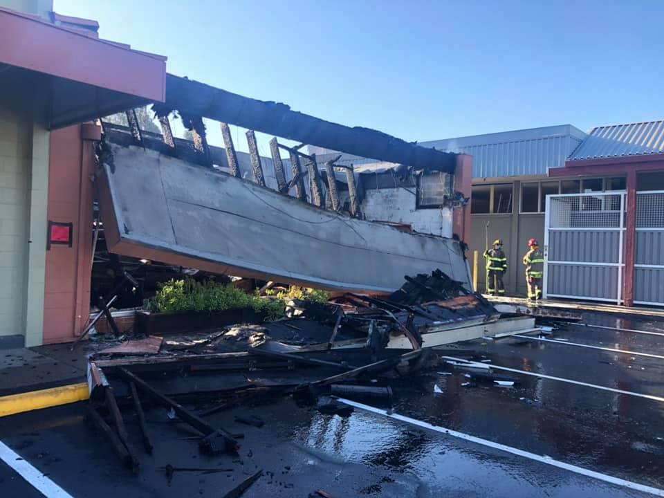 Fire crews mop up a blaze that destroyed a dry cleaning business in Ukiah, Friday, July 23, 2021. (Ukiah Valley Fire Department / Facebook)