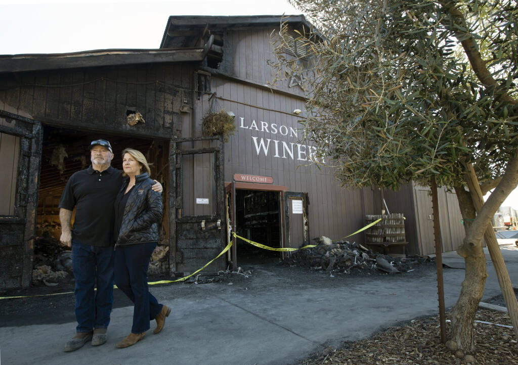 Tom and Becky Larson at the tasting room of the Larson Family Winery on Millerick Road on Thursday, March 10, 2022. The entire building, filled with bottles of wine and historical memorabilia, was gutted by fire on Wednesday, March 2, 2022. (Robbi Pengelly/Index-Tribune)