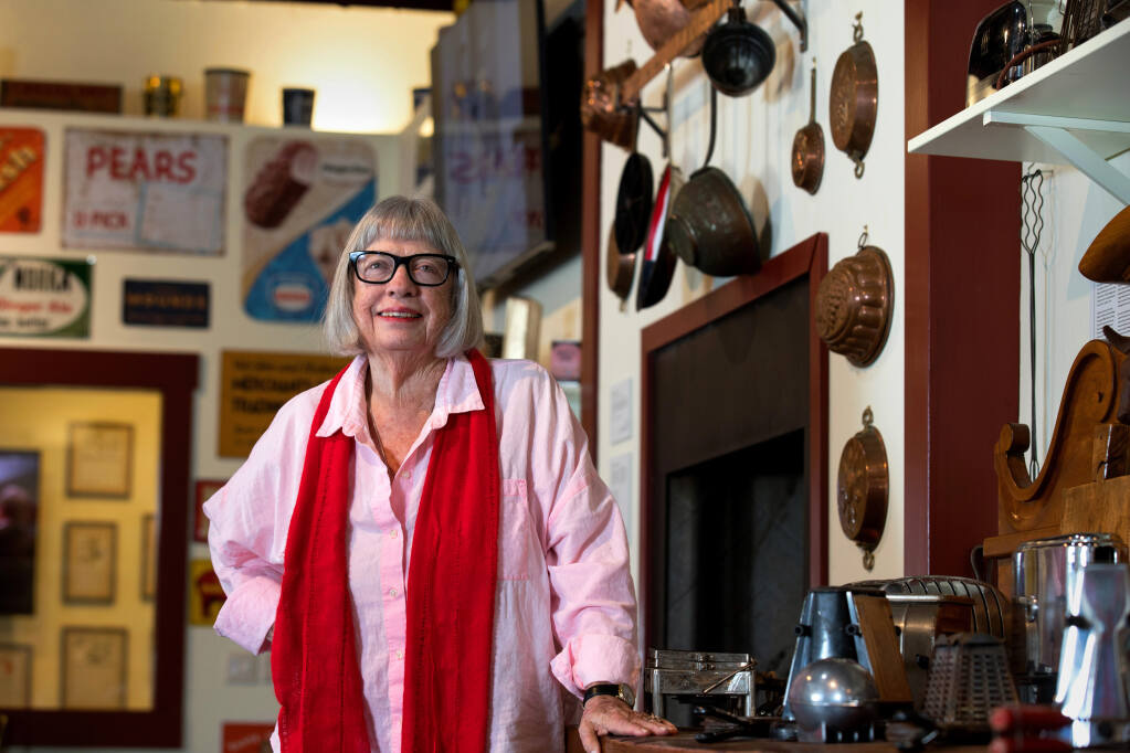 Kathleen Thompson Hill stands with her Kitchen Memories Collection at the Elizabeth Spencer Winery studio in Rutherford. The display is open to the public. (Darryl Bush / For The Press Democrat)