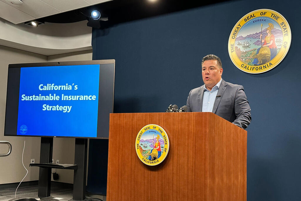 California Insurance Commissioner Ricardo Lara speaks during a news conference in a Sacramento on Thursday, Sept. 21, 2023. Lara announced a new plan aimed at keeping insurance companies from leaving the wildfire-prone state. (AP Photo/Adam Beam)