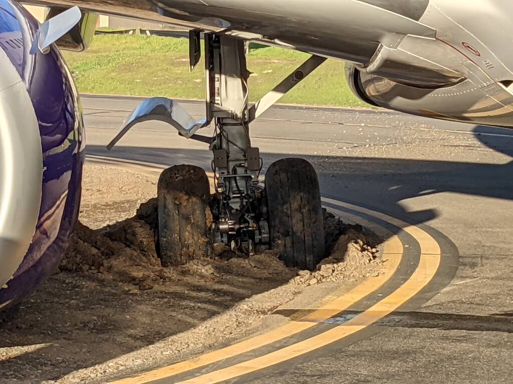 A plane set to take off from the Charles M. Schulz-Sonoma County Airport on Sunday was driven off the pavement on the way to a runway, prompting the evacuation of passengers on board, officials said. (Photo courtesy Tony Geraldi)
