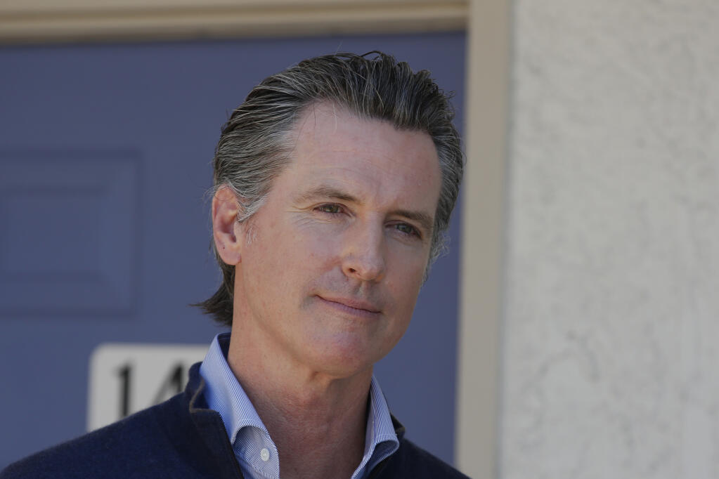 FILE - In this June 30, 2020 file photo Gov. Gavin Newsom listens to a reporters question during a news conference in Pittsburg, Calif. (AP Photo/Rich Pedroncelli, Pool,File)