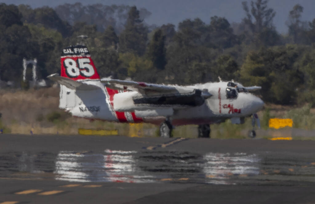Cal Fire tanker 85 returns to the ramp after staging in the run-up area for take off at Charles M. Schulz Sonoma County Airport Tuesday September 06, 2022. (Chad Surmick / Press Democrat)