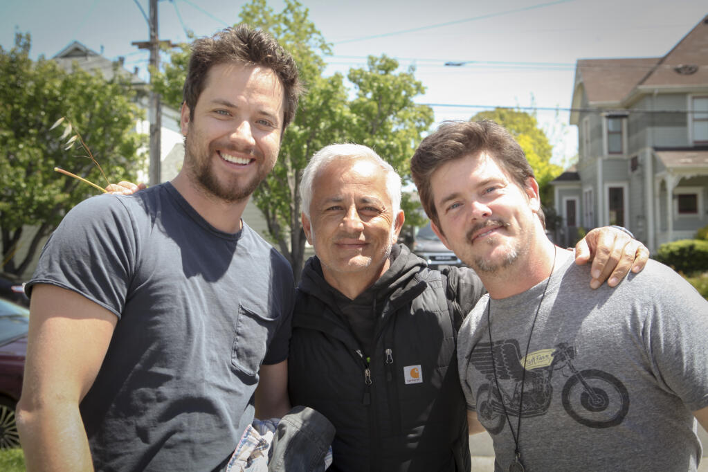 Producer Ali Afshar (center) poses with actor, Jeremy Sumpter (left) and director Shaun Piccinino (right) during filming of “Holiday Harmony” in Petaluma in April 2022. (CRISSY PASCUAL/ARGUS-COURIER STAFF)