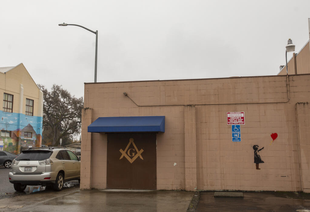 Street art signed by renowned artist Banksy, though not confirmed, seen Saturday, Dec. 3, on the back of Masonic Lodge 181 in Windsor, is thought to have appeared overnight Thursday, Dec. 1, 2022. (Chad Surmick/The Press Democrat)