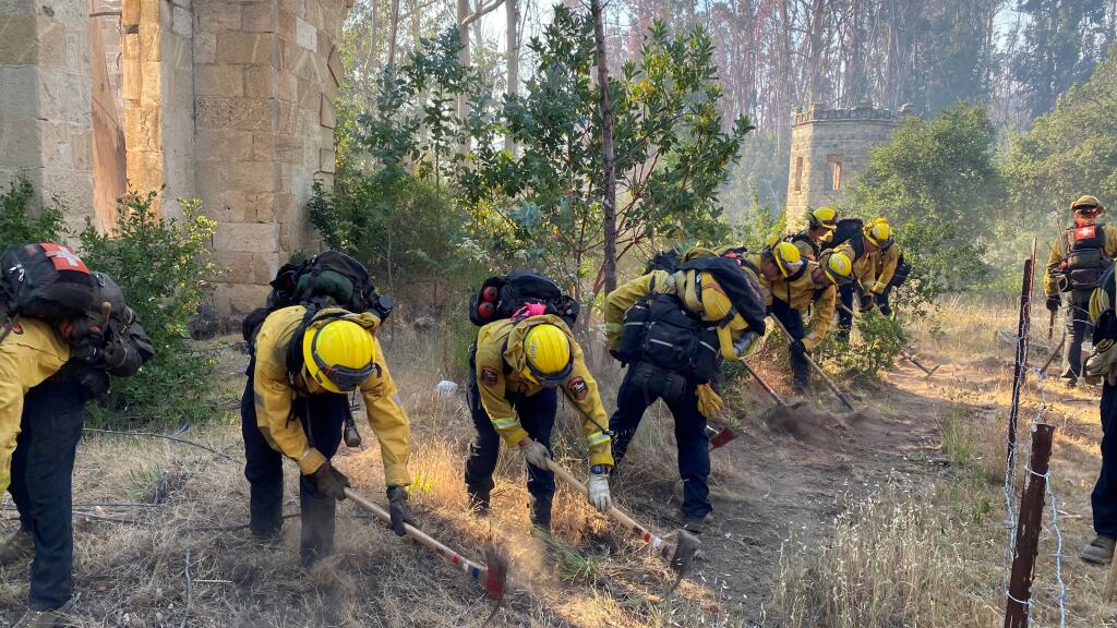 Cal Fire’s Blue Ridge crew cuts a fire line at old Soda Springs Resort Tuesday, May 31, 2022, while battling the Old fire just north of Napa. (Kent Porter/The Press Democrat)