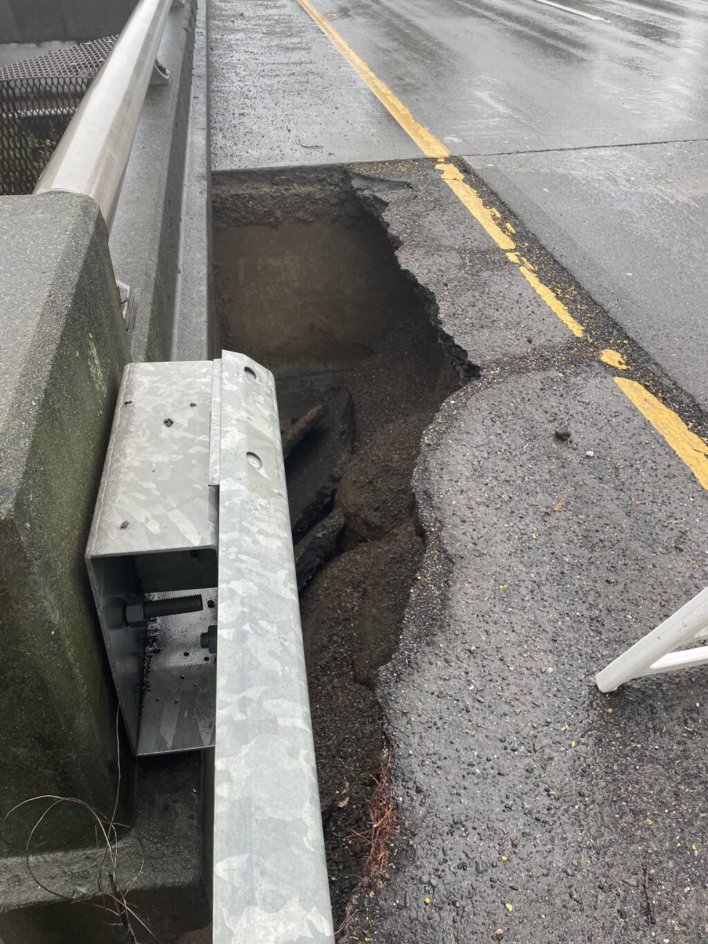 This image shows a sinkhole discovered Friday, Dec. 30, 2022 on westbound Highway 12 at Dutton Avenue in Santa Rosa. Traffic was expected to be reduced to one lane overnight. (California Highway Patrol)