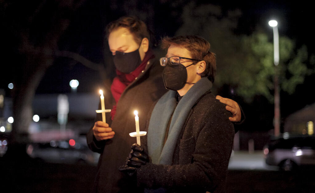 Josh Simmons (right) and his husband, Chris Neugebauer (left) attended the Light Up a Life event at Walnut Park in downtown Petaluma on Friday, December 2, 2022. The annual community event, hosted by Hospice, lets people gather in remembrance and celebration of the lives of lost loved ones. Josh’s brother, Scott Deihl, died suddenly last June. (CRISSY PASCUAL/ARGUS-COURIER STAFF)