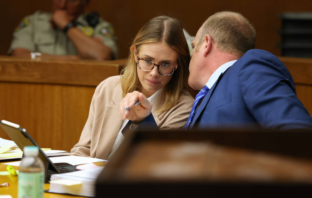 Defendant Katie Sorensen, left, listens to her defense attorney Charles Dresow during the first day of her trial in Sonoma County Superior Court in Santa Rosa on Tuesday, April 18, 2023.  (Christopher Chung/The Press Democrat)