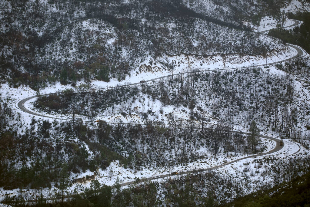Geysers Road zigzags through snow, Wednesday, Jan. 27, 2021 in the Mayacamas Mountains.  (Kent Porter / The Press Democrat) 2021