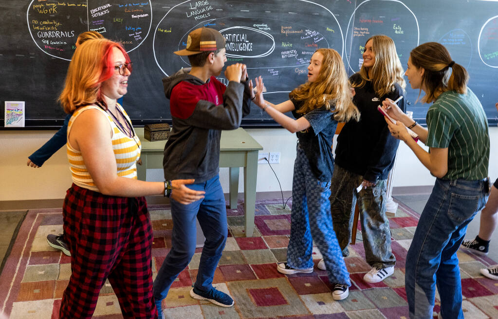 Drama students act out characters in motion during a warm up exercise in a Credo High School drama class in Rohnert Park, Friday, May 12, 2023. (John Burgess / The Press Democrat)