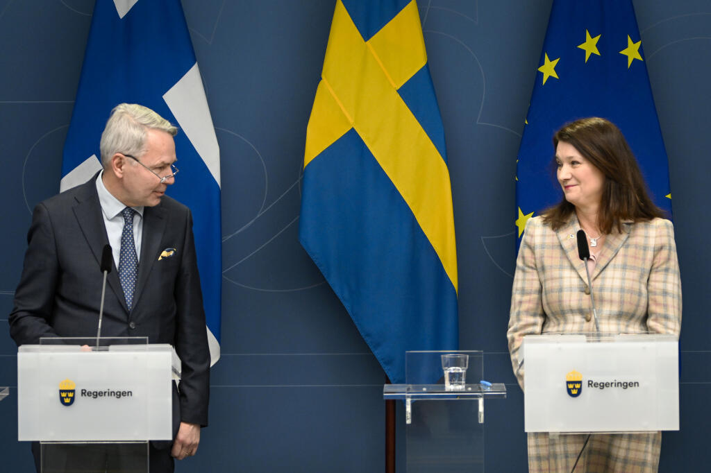 Finland's Minister for Foreign Affairs Pekka Haavisto, left and his Swedish counterpart Ann Linde take part in a joint press conference with Sweden's Defence Minister Peter Hultqvist, and his Finnish counterpart Antti Kaikkonen, in Stockholm, Sweden, Feb. 2, 2022, after talks on European security. Throughout the Cold War and in the decades since it ended, nothing could persuade Finns and Swedes that they would be better off joining NATO, until now. Russia’s invasion of Ukraine has profoundly changed Europe’s security outlook, including for Nordic neutrals Finland and Sweden, where support for joining NATO has surged to record levels. (Anders Wiklund, TT News Agency via AP, File)