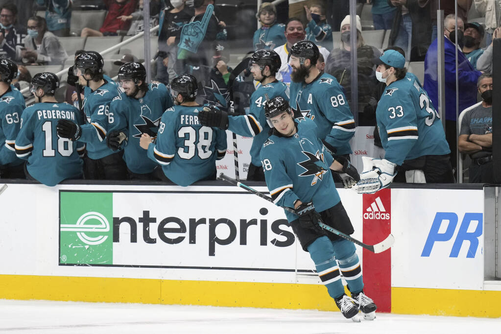 San Jose Sharks right wing Timo Meier (28) is congratulated after scoring a goal during the second period against the Los Angeles Kings during an NHL hockey game in San Jose, Calif., Monday, Jan. 17, 2022. (AP Photo/Darren Yamashita)