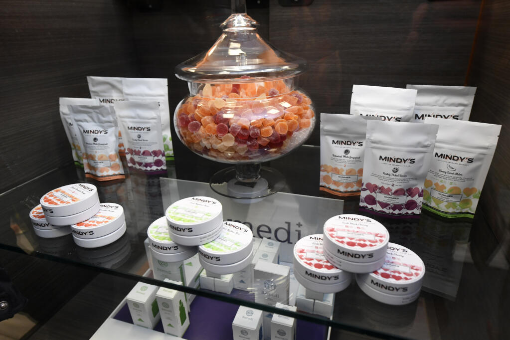 FILE - In this Jan. 1, 2020, file photo is a display case of cannabis edibles at the Sunnyside marijuana dispensary in Chicago. (AP Photo/Paul Beaty, File)