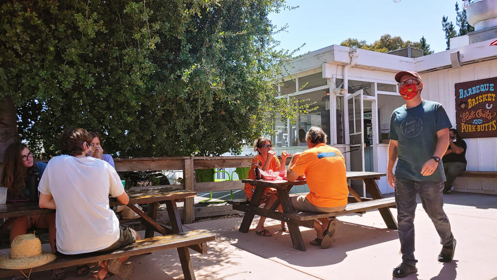 Customers at afternoon lunch at Lou's Lucheonette in Schellville, on Highway 121 between Napa and Sonoma. The Aug. 8, 2020, scene shows most diners wearing face masks and social distancing during the coronavirus pandemic. (Christian Kallen/Index-Tribune)